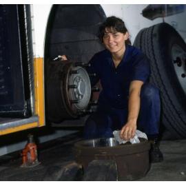 Bus being Serviced by Female Mechanic - 1995