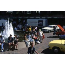 People Sitting Around City Plaza Fountain - 1978