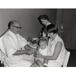 Infant Receiving an Injection - City Hall - 1971