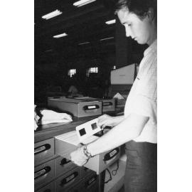 Brisbane City Council Staff Member filing Microfilm Cards