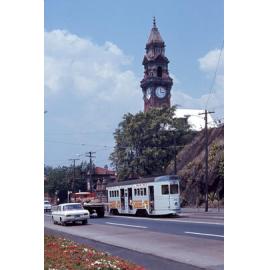 Tram No. 410 on Stanley Street with view of South Brisbane Town Hall clock tower - 1968