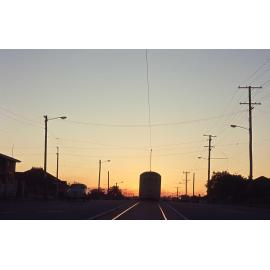 Shot of tram No. 411 on O'Keefe Street at sunset, Woolloongabba - 1969