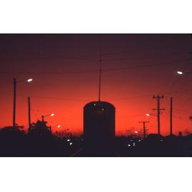 Tram during a red sunset, O'Keefe Street, Woolloongabba -1969