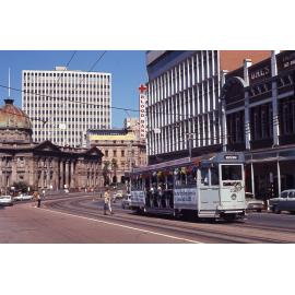 Tram No. 231 festooned in ribbons, filled with tram drivers outside Customs House, Queen Street, 1969