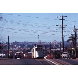 Tram No. 474 cresting hill on Gladstone Road with view of Story Bridge, Highgate Hill - 1969