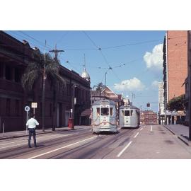 Tram No. 412 painted with flowers and covered with ribbons with No. 531 on Wharf Street - 1969