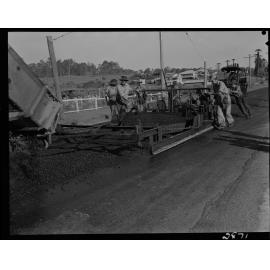 Work crew spreading asphalt - 1952