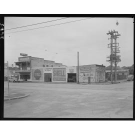 Shell motor mechanic and Qualco furniture on the corner of Melbourne Street, West End - 1952