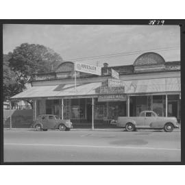 Building facade of displaying advertising and signs for ESR Laren Butcher and Hopkinson and Son Radio and Electrical Dealers - 1953