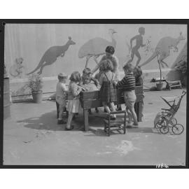 Children playing with sandbox at Kindercraft Civic Nursery (childcare) City Hall - 1950