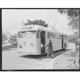 No. 10 Trolley bus in Gregory Terrace with woman boarding, Fortitude Valley, 1951