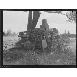 Worker excavating for small mains  - 1949