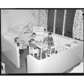 Children playing with dolls at Kindercraft Civic Day Nursery at City Hall - 1956
