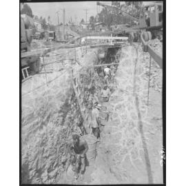 Council workers digging trench for Wynnum to Tarragindi sewer mains, possibly in Cannon Hill - 1958
