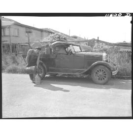Council worker refilling insecticide canister as part of mosquito control - 1959
