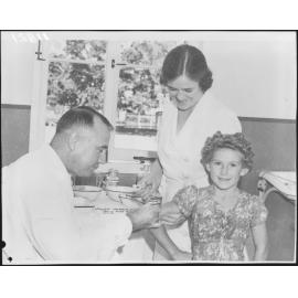 Immunisation program at City Hall with young girl