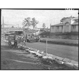 Lowering roadworks for the Countess Street rail bridge with Victoria Barracks building, Petrie Terrace and Brisbane City - 1959