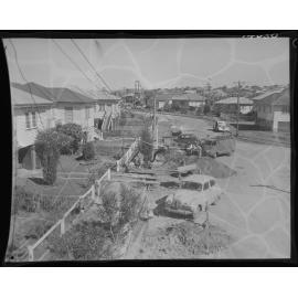 Inspecting collapsed footpath over sewer pipe for North Kedron Brook sewer line - 1960