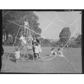 Children playing rugby and on equipment at Catholic children's home - 1960