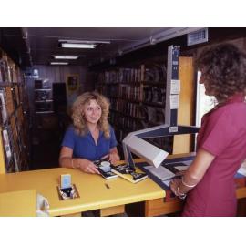 Mobile Library - Staff Serving Customers and Filling Books on Shelves - 1989